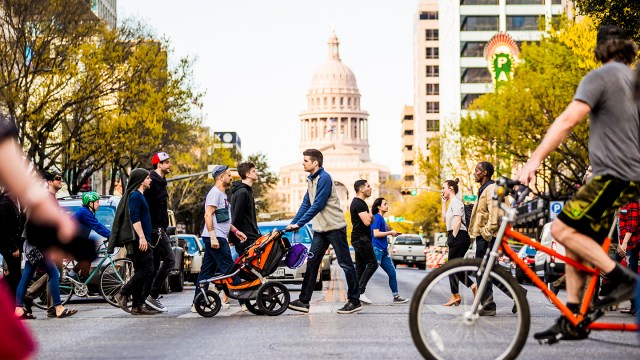 People crossing Congress with view of capital building - Photo by Aaron Rogosin