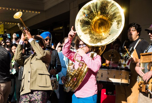 After the afternoon screening of A Tuba to Cuba, the Preservation Hall Jazz Band led a second line parade from the Paramount Theatre to the Mohawk. Photo by Jordan Hefler