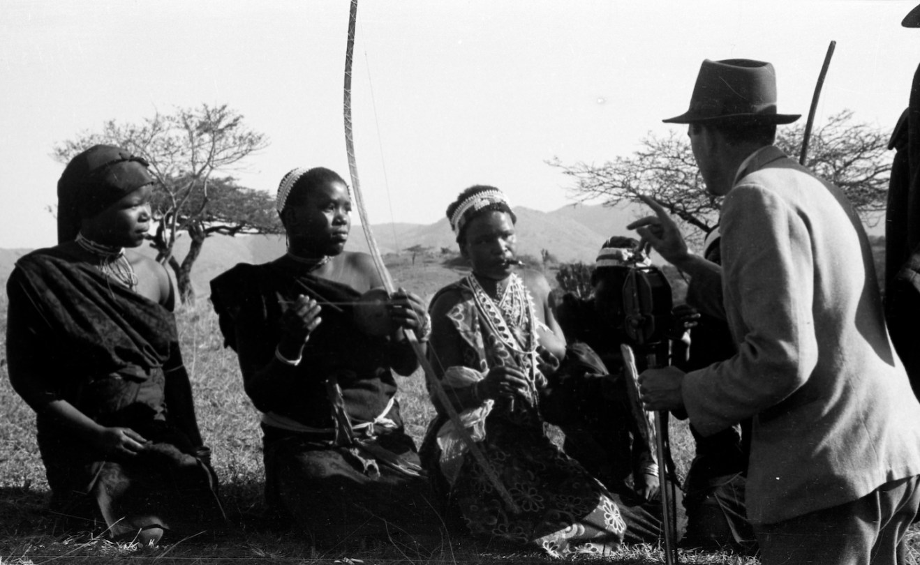 In this 1952 photo that inspired Beating Heart’s creation, Mbuti Pygmies listen to a recording of their own music made by ethnomusicologist Hugh Tracey. Photo courtesy of Chris Pedley.